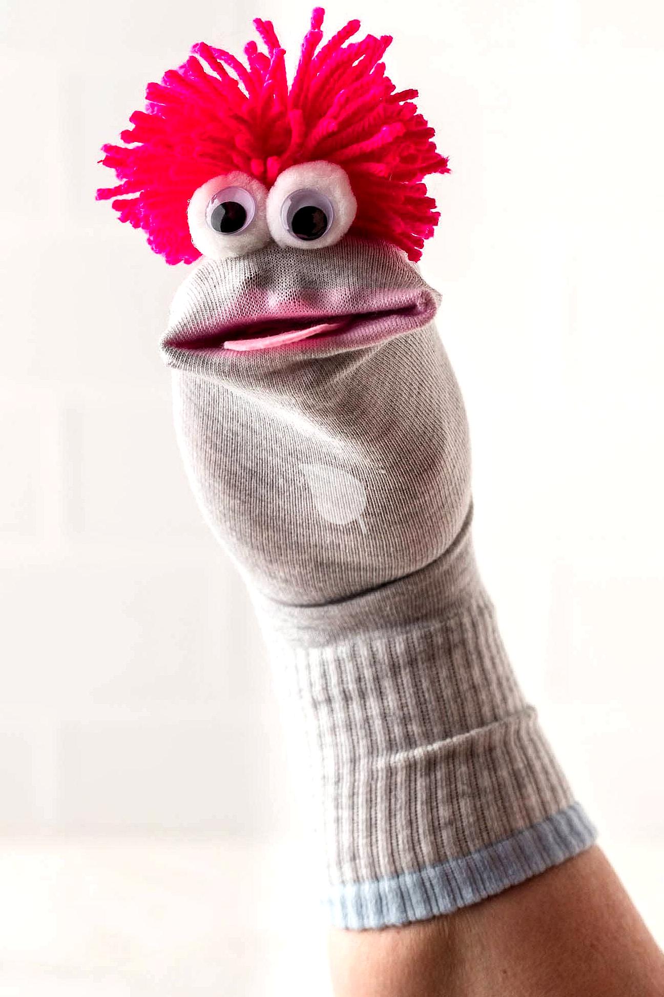 Homemade sock puppets with large eyes and mouth